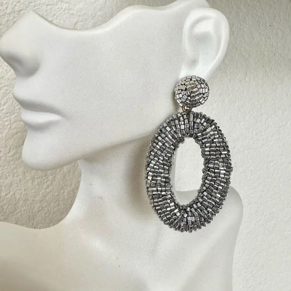 Silver tone beaded oval statement earrings